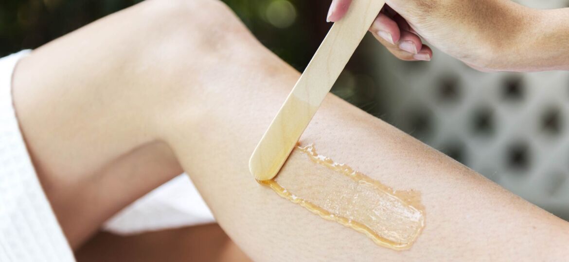 woman-getting-legs-waxed-at-a-spa-PFWLHKD_low